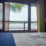 Riverine Hut – A charming eco-friendly hut nestled by the backwaters, providing a rustic yet comfortable stay close to nature at Riverine Homestay.
