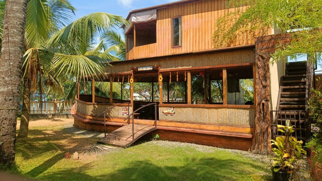 Riverine Hut – A charming eco-friendly hut nestled by the backwaters, providing a rustic yet comfortable stay close to nature at Riverine Homestay.